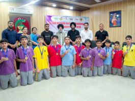 Winners posing along with dignitaries during prize distribution ceremony.