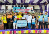 Dignitaries presenting player of the match award during a programme.