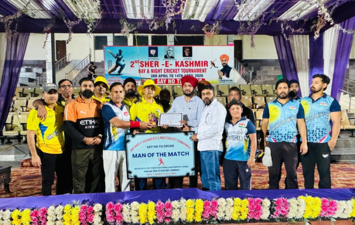 Dignitaries presenting player of the match award during a programme.