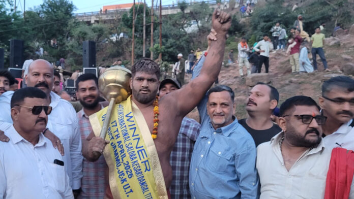 Wrestler posing along with dignitaries.