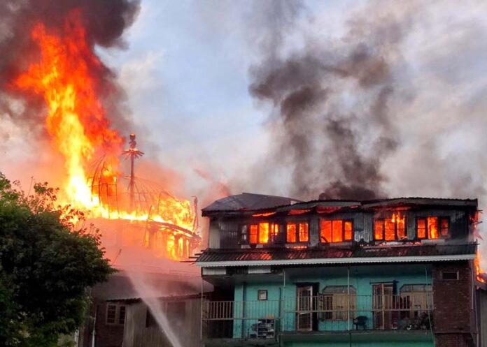 Jamia Arabia Ashraful Uloom in Hyderpora in flames on Friday. -Excelsior/Shakeel Jamia Arabia Ashraful Uloom in Hyderpora in flames on Friday. -Excelsior/Shakeel