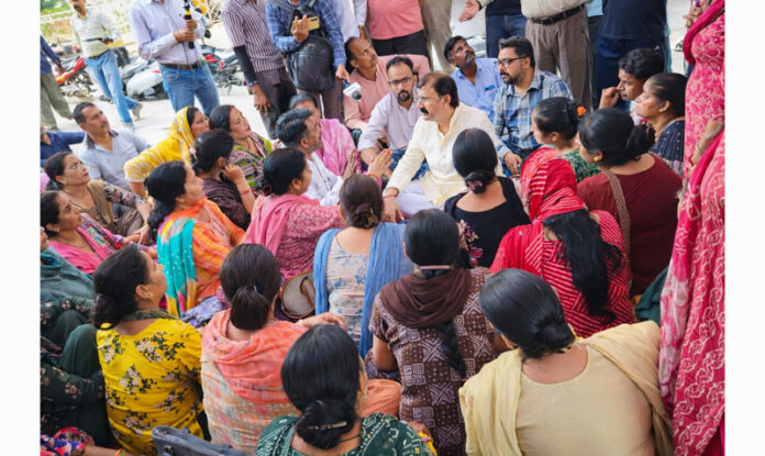 MLA Jammu West, Arvind Gupta interacting with protesting workers of Pencil Factory Jammu on Thursday.