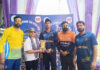 Dignitary presenting player of the match award during post-match presentation.