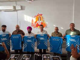 Dignitaries unveiling Dogra Legacy Half Marathon jersey during an event on Friday.