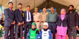 Dignitaries posing along with athletes.
