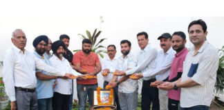 Former Minister Manjit Singh paying floral tribute to Sant Dhanna Jatt on Tuesday.