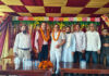 Dr Manohar Lal Sharma posing along with the people during his tour in Billawar.