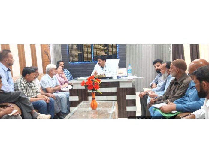 CMO Poonch Dr Parvaiz Ahmed Khan chairing a meeting.