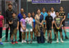 Badminton players posing along with dignitaries.
