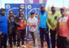 Dignitary presenting player of the match award during prize distribution ceremony.