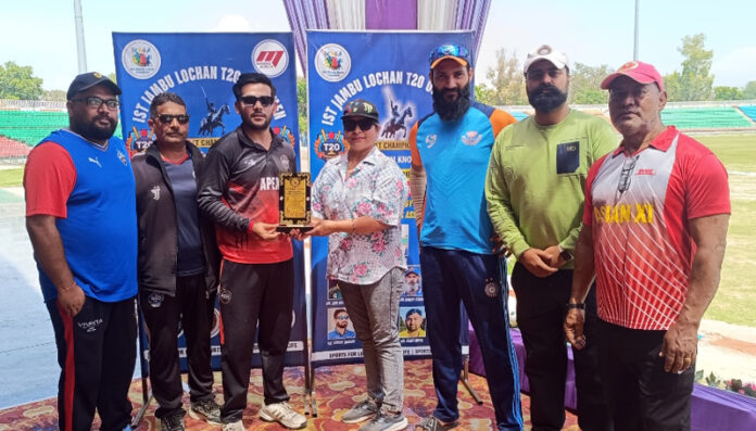 Dignitary presenting player of the match award during prize distribution ceremony.