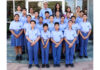 Students posing along with school management.