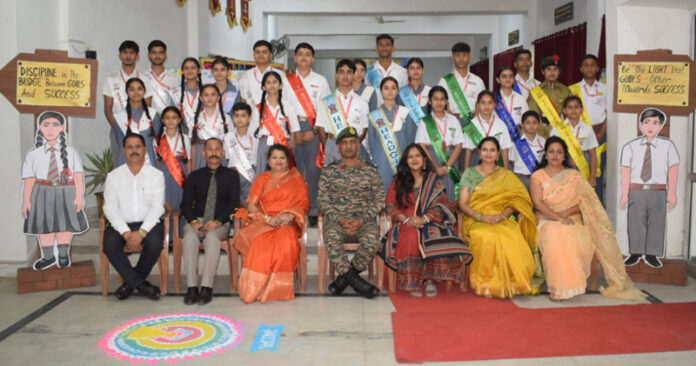 Students posing along with dignitaries during a programme.