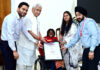 Lieutenant Governor Manoj Sinha presenting a memento to International Para-Archer Payal Nag at Lok Bhavan.