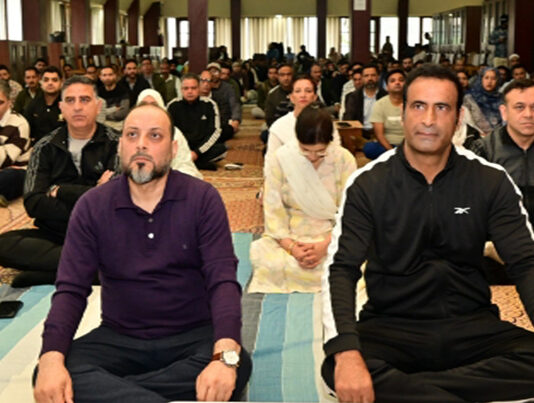 Judicial officers participating in a Yoga session at District Court Complex, Mominabad, Srinagar.