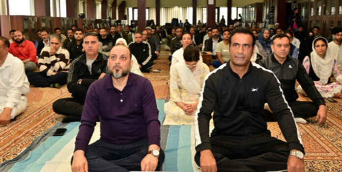 Judicial officers participating in a Yoga session at District Court Complex, Mominabad, Srinagar.