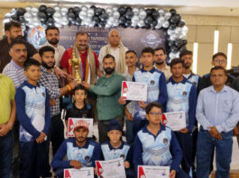 Winning team posing along with dignitaries.