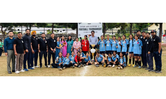 Winning team posing along with dignitaries during a programme.