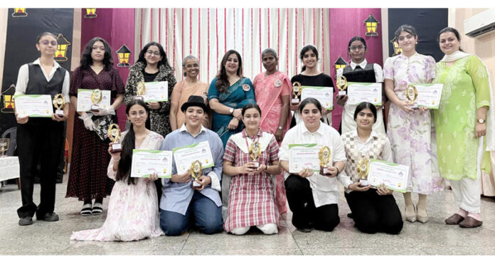 Students posing along with dignitaries during a programme.