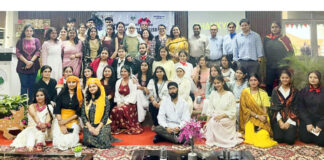 Participants posing along with dignitaries during a programme.