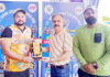 Dignitary presenting Player of the Match award during post-match presentation ceremony.