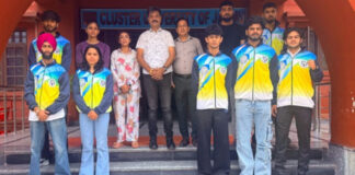 Wushu players posing along with Director of Physical Education and Sports, Cluster University of Jammu.