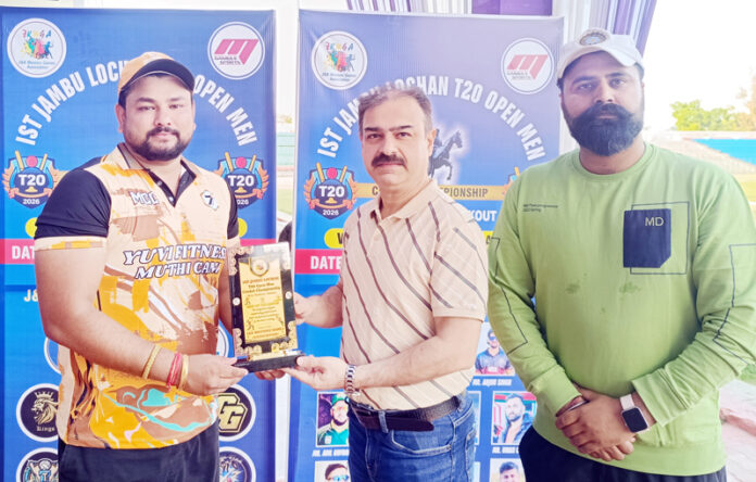 Dignitary presenting Player of the Match award during post-match presentation ceremony.