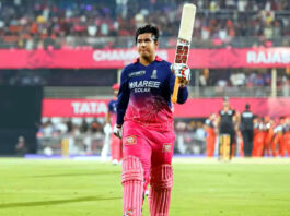Vaibhav Sooryavanshi raising bat after scoring 78 runs against RCB.