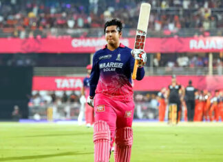Vaibhav Sooryavanshi raising bat after scoring 78 runs against RCB.