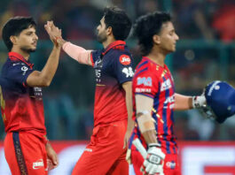 Rasikh Salam Dar celebrating with teammate after his impressive spell of 4/24 against LSG in Lucknow.