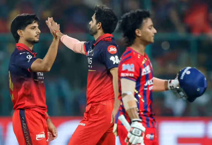 Rasikh Salam Dar celebrating with teammate after his impressive spell of 4/24 against LSG in Lucknow.