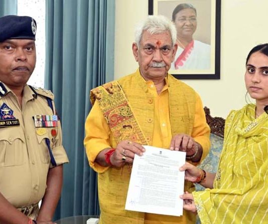 LG Manoj Sinha handing over appointment letter to the wife of martyr Sub-Inspector Deepak Sharma on Thursday.