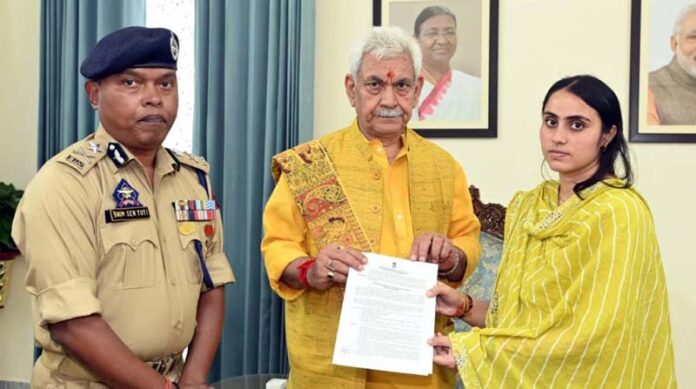 LG Manoj Sinha handing over appointment letter to the wife of martyr Sub-Inspector Deepak Sharma on Thursday.