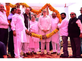 Chief Minister Omar Abdullah being welcomed at Nowshera on Monday.