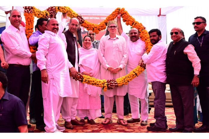 Chief Minister Omar Abdullah being welcomed at Nowshera on Monday.