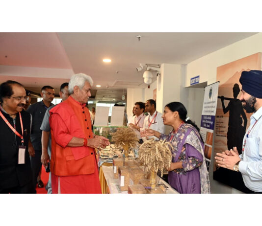 LG inspecting a stall at SKUAST Jammu on Tuesday.