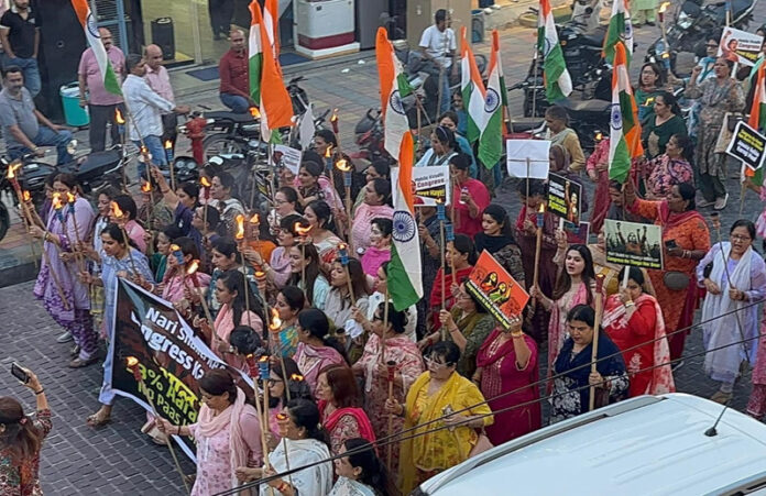 BJP Mahila Morcha taking out rally in Jammu on Wednesday.