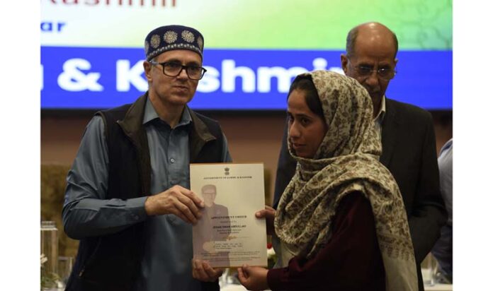 Chief Minister Omar Abdullah giving appointment letter under the Rehabilitation Assistance Scheme at SKICC, Srinagar on Thursday. -Excelsior/Shakeel Chief Minister Omar Abdullah giving appointment letter under the Rehabilitation Assistance Scheme at SKICC, Srinagar on Thursday. -Excelsior/Shakeel