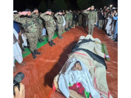 Army soldiers paying respect to Fazal Tahir Choudhary, a hero of operation ‘Sarp Vinash’ at Hill Kaka in Poonch. -Excelsior/Imran