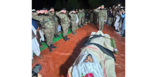 Army soldiers paying respect to Fazal Tahir Choudhary, a hero of operation ‘Sarp Vinash’ at Hill Kaka in Poonch. -Excelsior/Imran