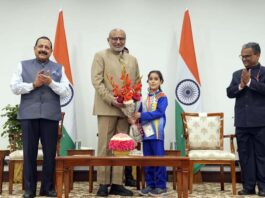 Vice-President being greeted by a child at New Delhi on Thursday. Union Minister Dr Jitendra Singh is also seen.