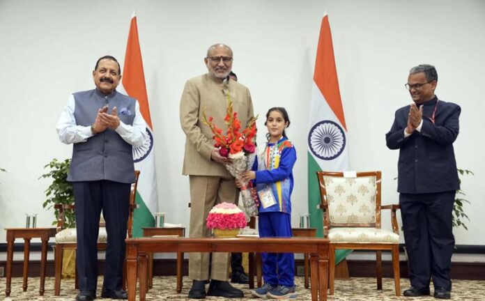 Vice-President being greeted by a child at New Delhi on Thursday. Union Minister Dr Jitendra Singh is also seen.