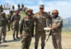 Lt Gen PK Mishra posing with soldiers while presenting an award to one of them at Dogrian area in Poonch on Tuesday.