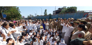 PSPS GCW Gandhi Nagar students staging a demonstration outside the campus on Monday. — Excelsior/Rakesh