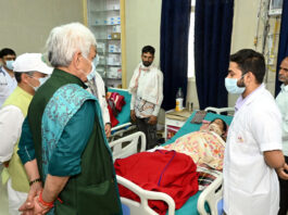 LG meeting injured persons at GMC Udhampur on Monday.