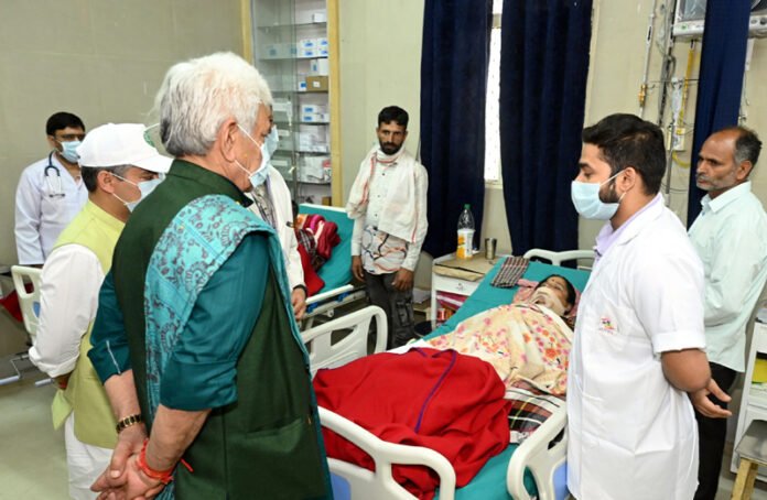 LG meeting injured persons at GMC Udhampur on Monday.
