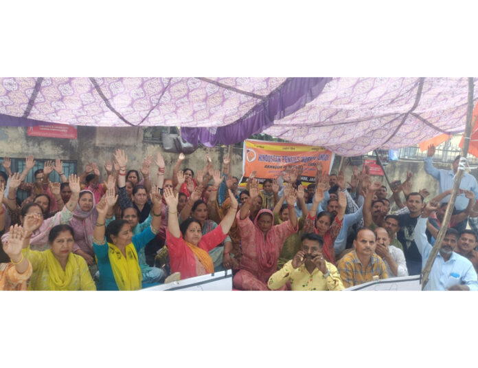 Workers of M/s Hindustan Pencils Private Limited staging dharna outside the factory gate in Jammu.
