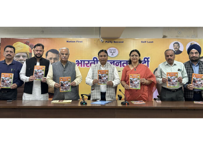 BJP leaders releasing Special Edition of its monthly publication `Kamal Paigam' at Party Headquarters, Trikuta Nagar on Tuesday.