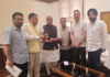 A delegation of NC MPs and MLAs posing with Defence Minister Rajnath Singh at Parliament House, New Delhi on Friday.
