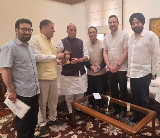 A delegation of NC MPs and MLAs posing with Defence Minister Rajnath Singh at Parliament House, New Delhi on Friday.